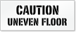 Caution, Uneven Floor Pavement And Parking Stencil